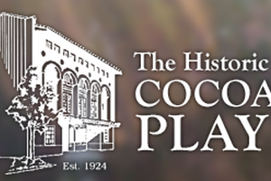 Picture of an old looking building with text saying the history of cocoa